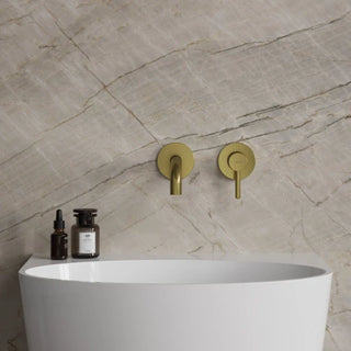 Omnires Y / basin mixer for concealed installation / Brushed Brass / on the stone wall