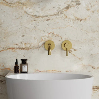 Omnires Y / basin mixer for concealed installation / Brushed Gold / on the stone wall