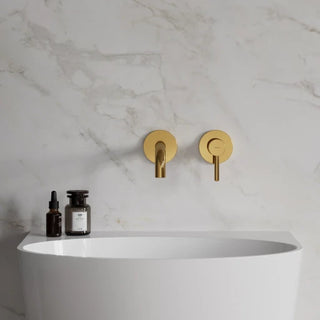 Omnires Y / basin mixer for concealed installation / Gold / on the gray wall