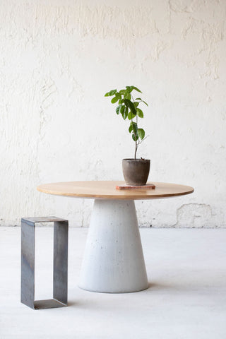 Minimalistic design dining table. Natural oak table top, concrete table base 3