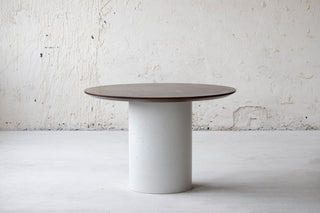 Minimalistic design cylinder base dining table. Natural oak table top, concrete table base